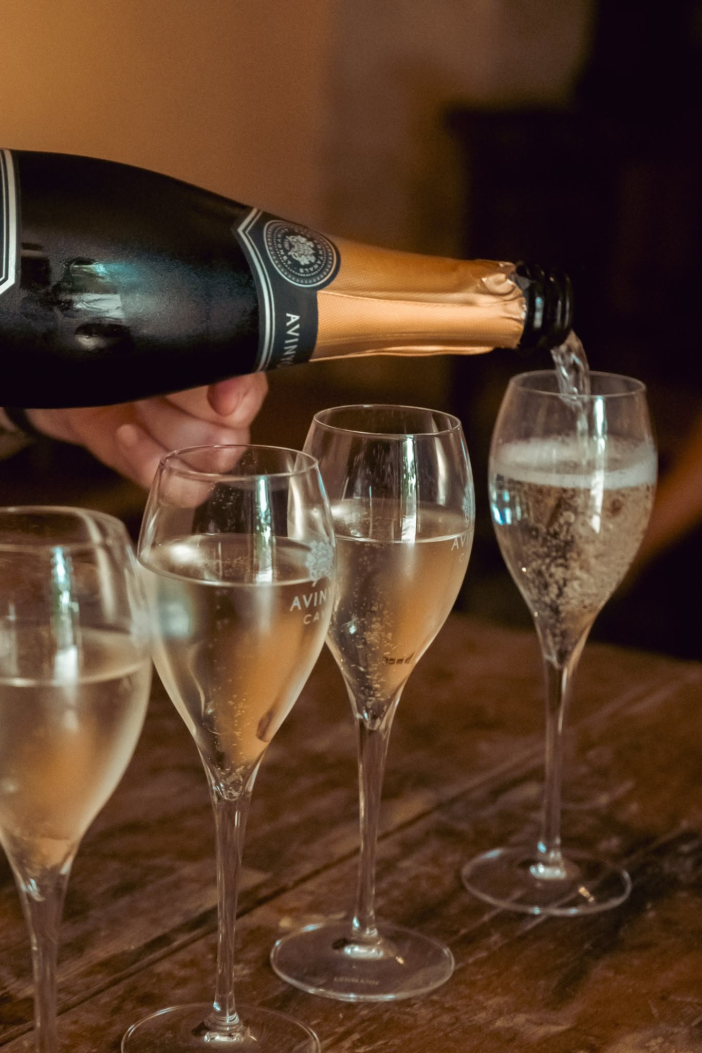 Cava poured into tall glasses at the tasting