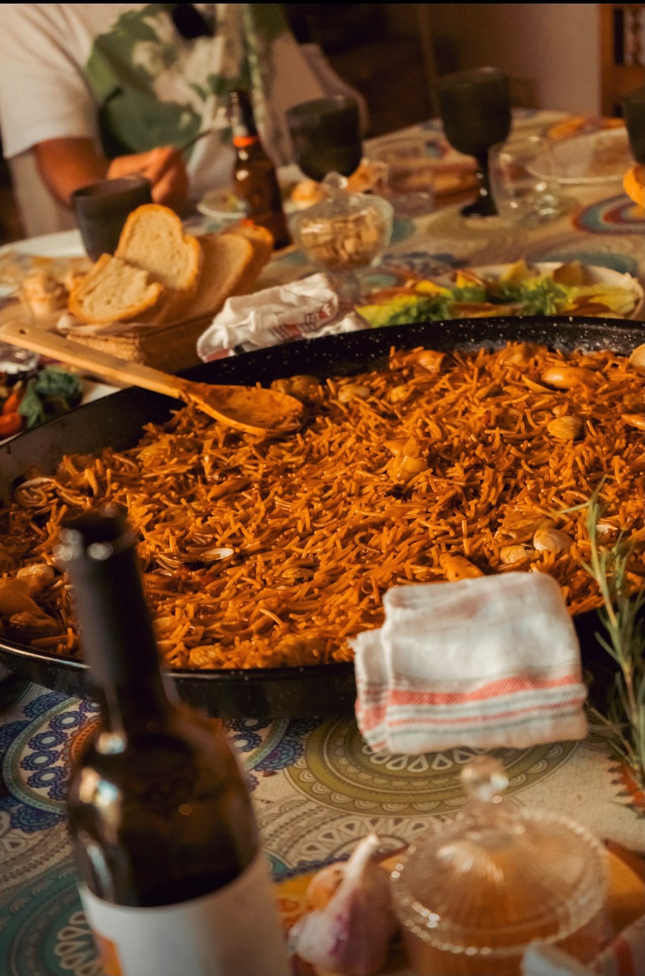 Seafood rice served with fresh bread at the table