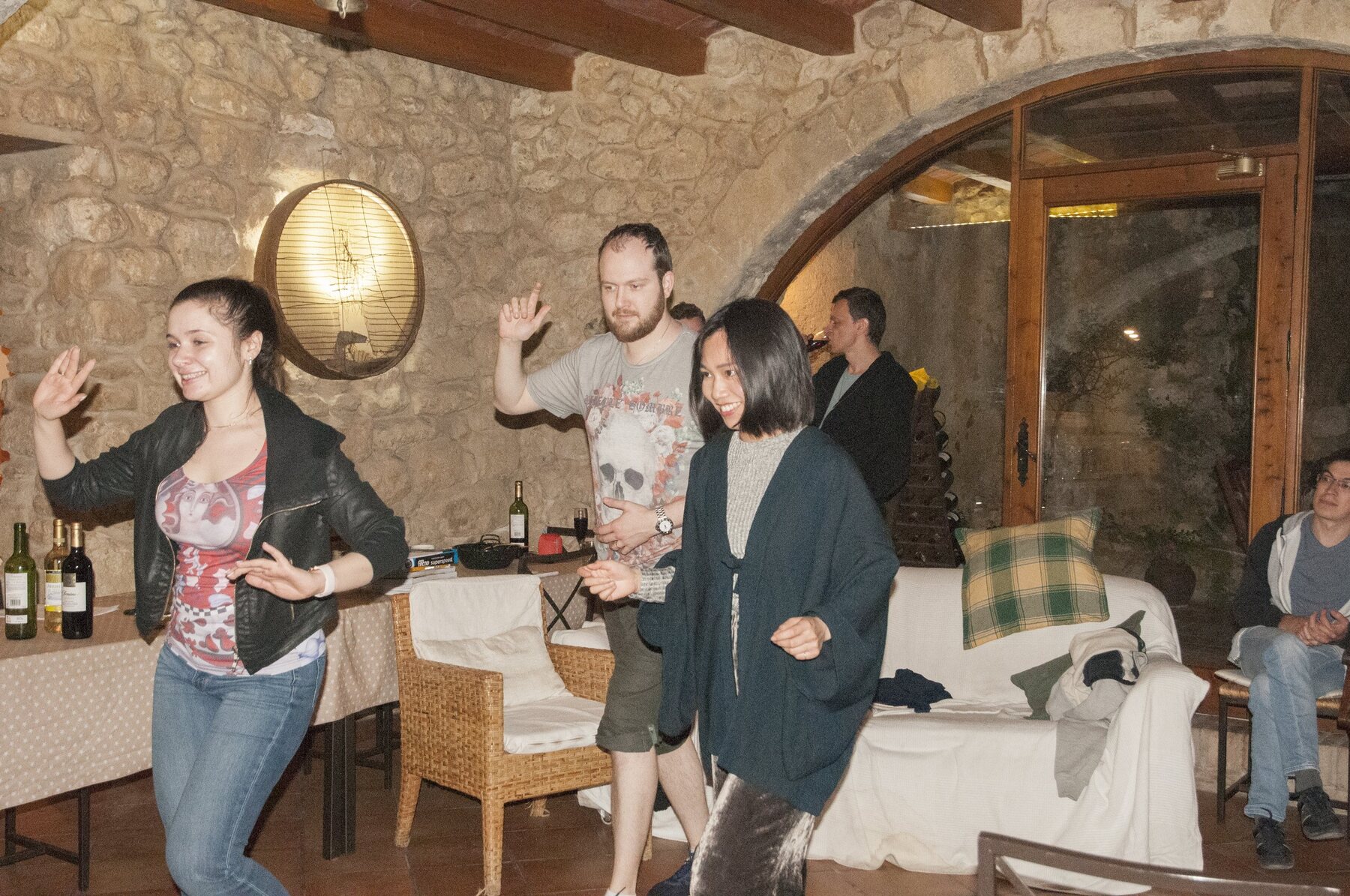 Laughter in the arched living room during an afternoon break