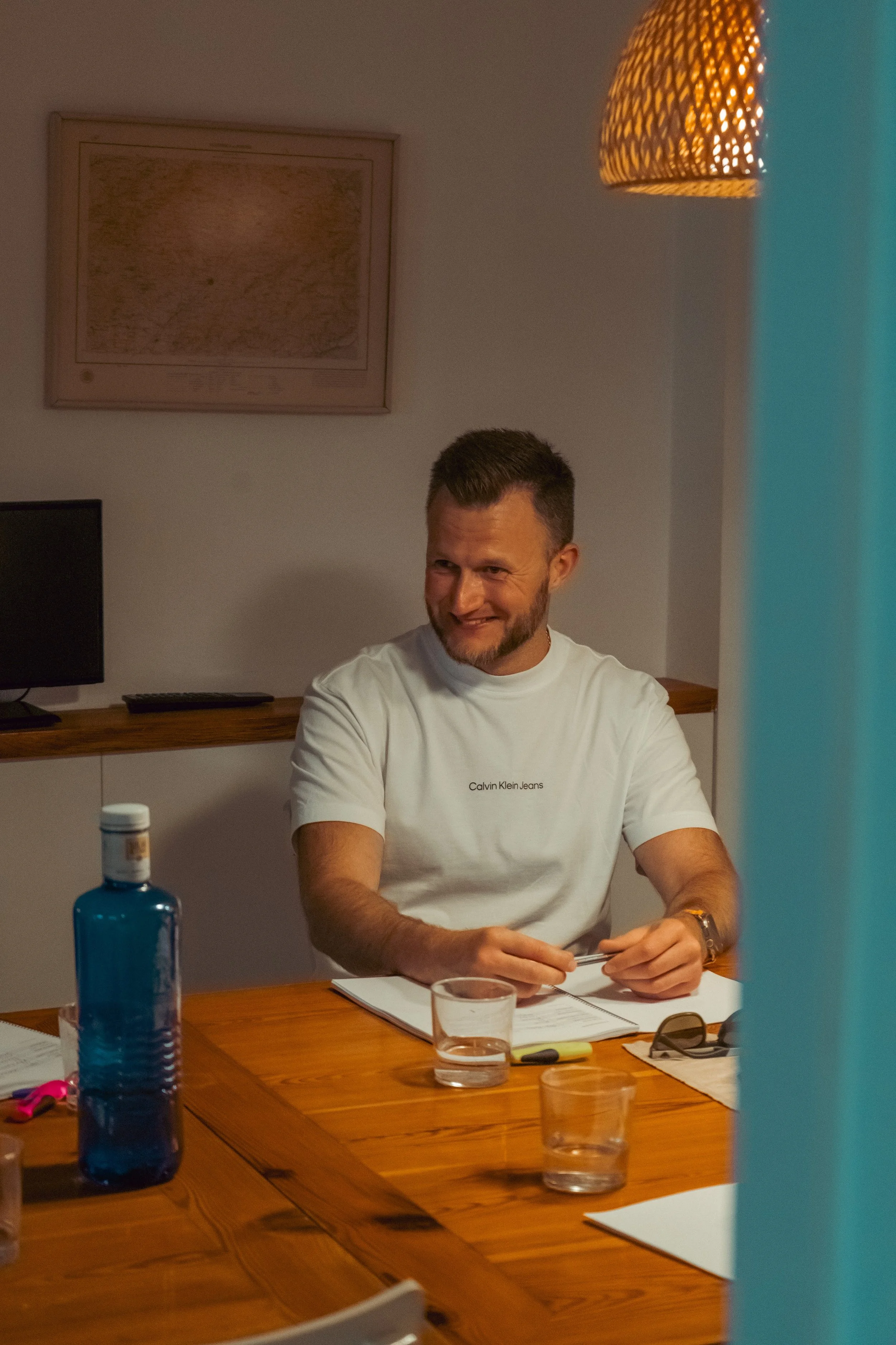 A guest working through his notes at the desk
