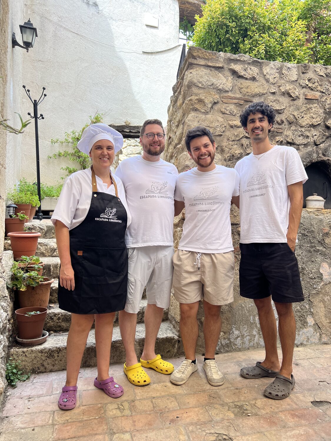 The group with the chef after a cooking session in the courtyard